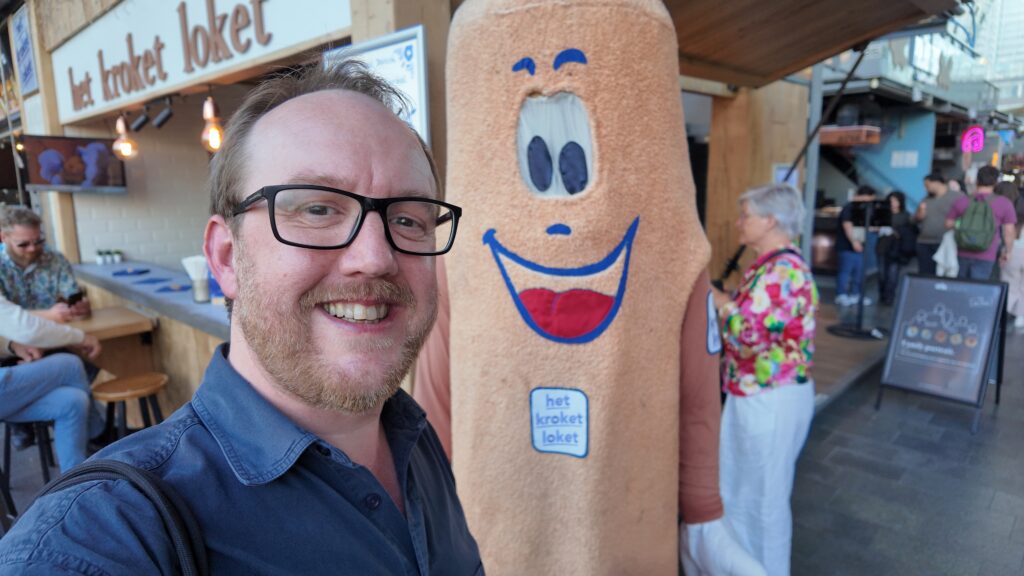 Mark Rees with a giant Croquette in Rotterdam's Markthal.
